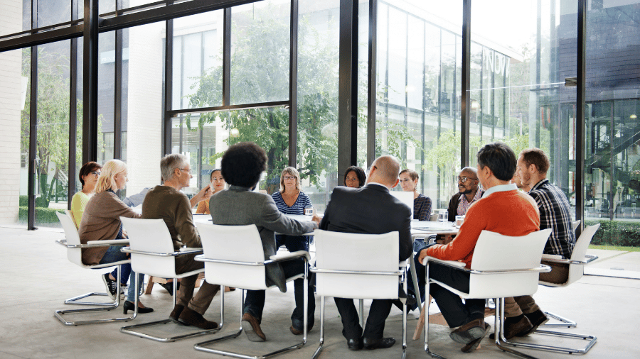 Association event impact planning session against glass windows