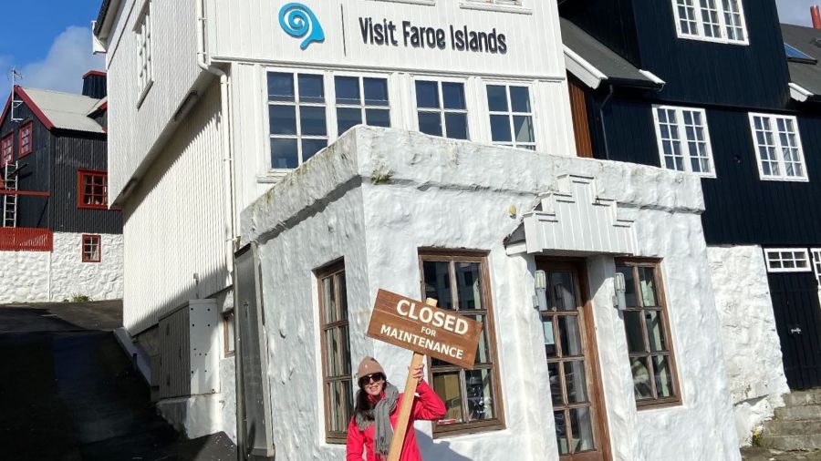 Closed for Maintenance signpost against Visit Faroe Islands building