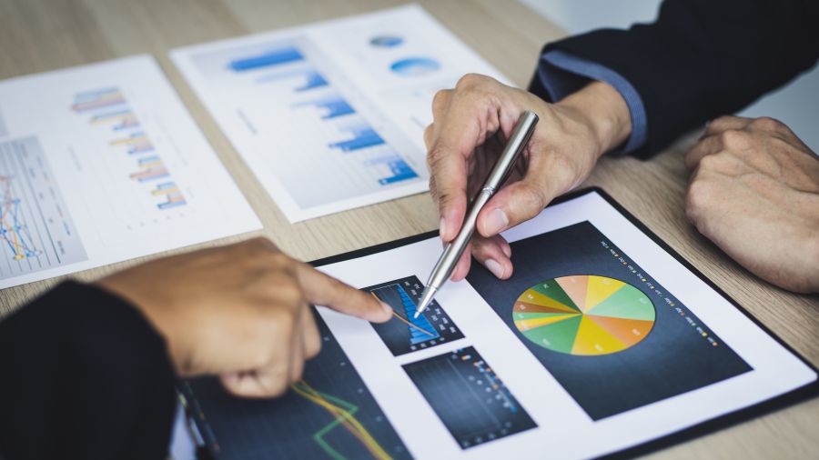two professionals investigate insights in bar graphs
