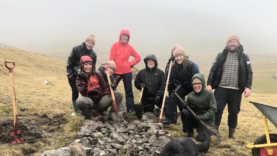 volunteers pose during closed for maintenance campaign on faroe islands